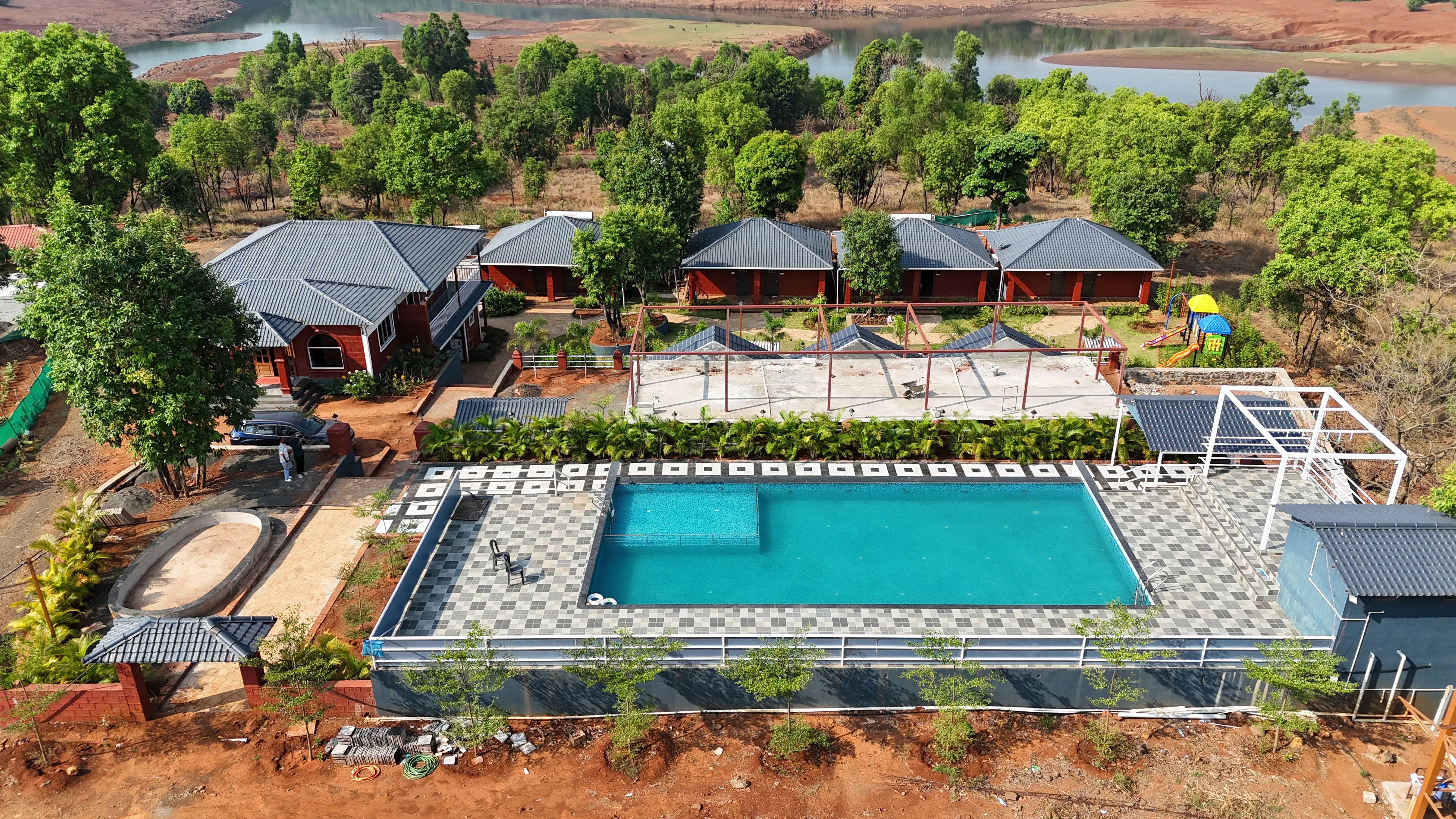 Green landscape surrounding Aranyagiri Farmstay Resort Tapola
